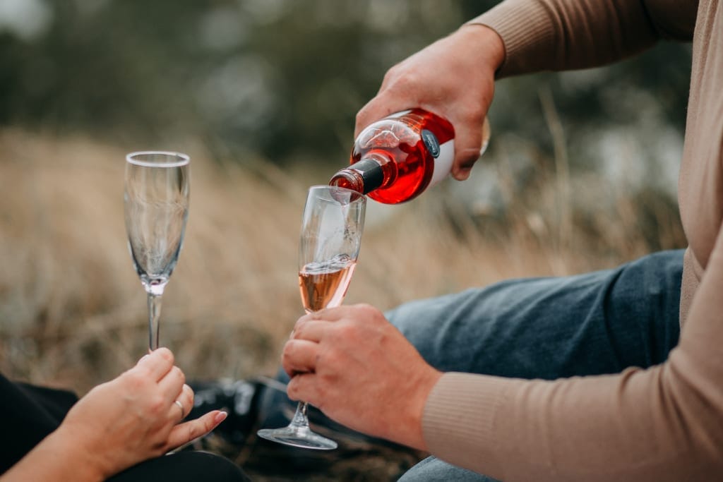 pouring wine in nature
