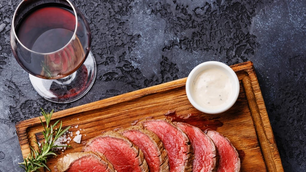 meat on a wooden plate