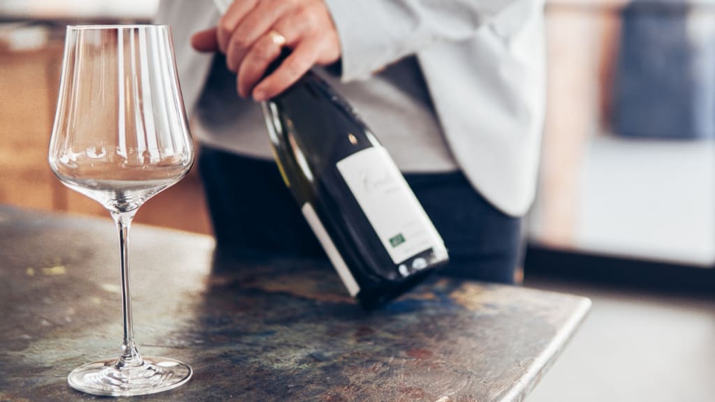 opening a wine bottle