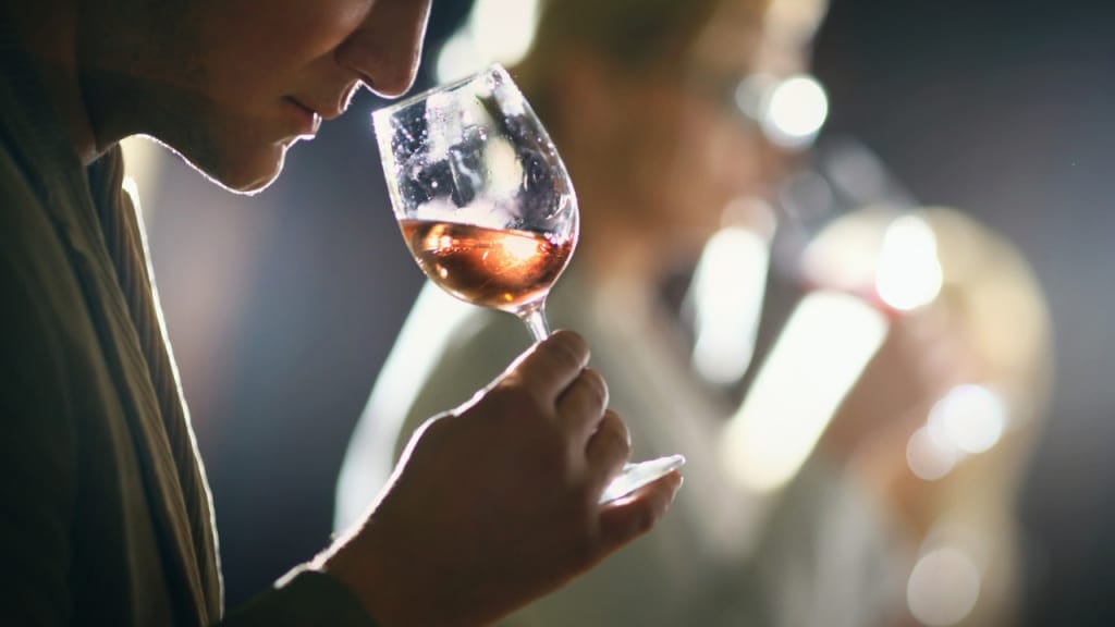 smelling wine's aroma at a tasting