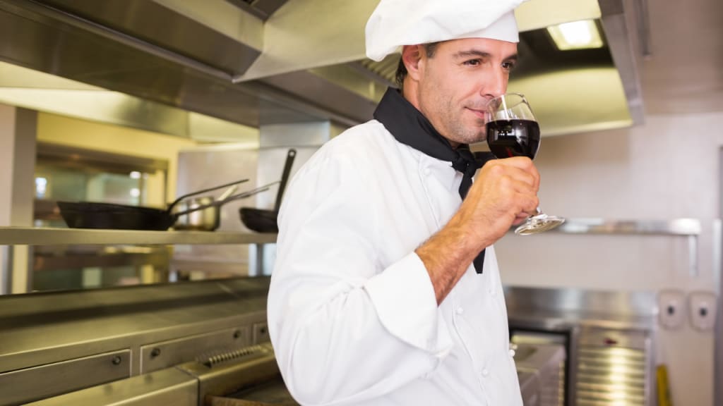 chef smelling wine