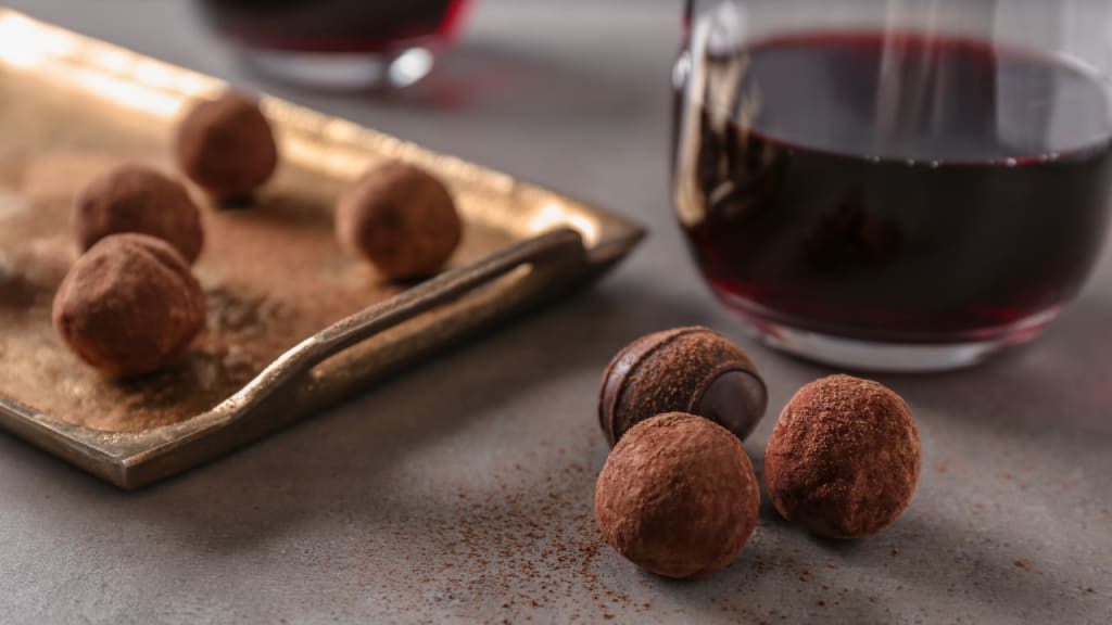 glasses on a table with truffle chocolates