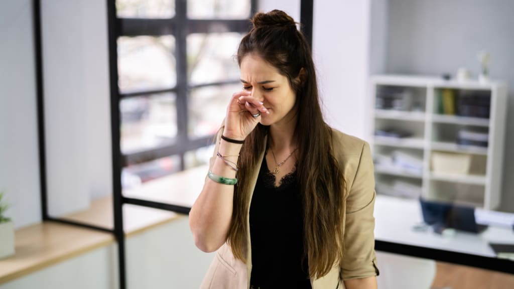 sad lady because of bad smell