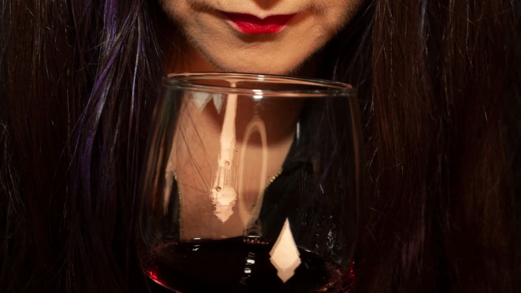 black hair woman and wine glass